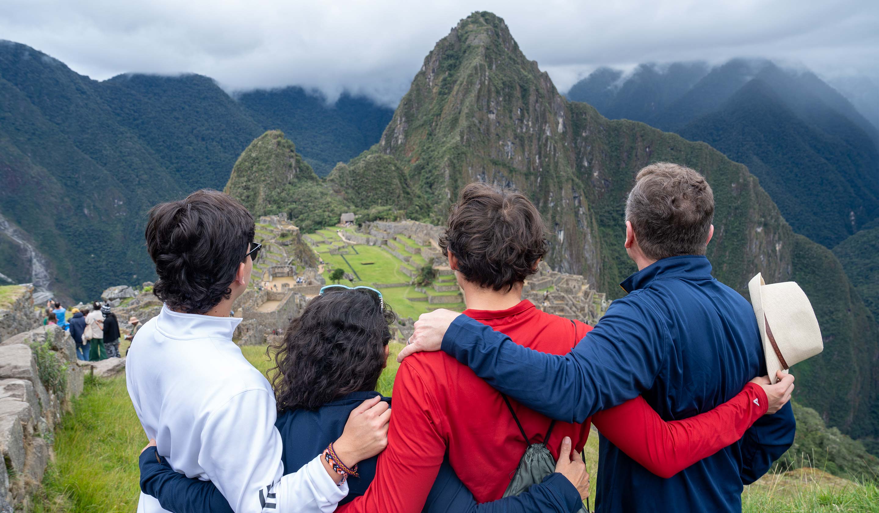 Family overlooking Machu Picchu