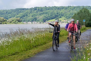 Guests cycle along the Seine